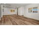 Spacious, bright living room with wood-look flooring and multiple windows for natural light at 3104 E Broadway Rd -- # 287, Mesa, AZ 85204