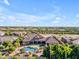 A well-manicured estate showcases a luxurious pool, expansive grounds, and an elegant residence, offering privacy and sophistication at 3446 E Knoll St, Mesa, AZ 85213