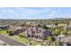 Expansive aerial view of a luxurious home with landscaped grounds, showcasing its impressive curb appeal and neighborhood at 3446 E Knoll St, Mesa, AZ 85213