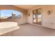 Stucco walled outdoor balcony featuring wood double doors at 3446 E Knoll St, Mesa, AZ 85213