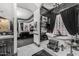 Luxurious bathroom featuring a fireplace, soaking tub, and views into the bedroom at 3446 E Knoll St, Mesa, AZ 85213