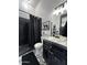 Modern bathroom with black accents, marble countertop, and stylish finishes at 3446 E Knoll St, Mesa, AZ 85213