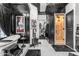 Bathroom featuring a soaking tub, adjacent closet, and stylish black accents at 3446 E Knoll St, Mesa, AZ 85213