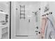Bright bathroom showcasing a glass shower, stone accents, and storage cabinet at 3446 E Knoll St, Mesa, AZ 85213