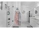 Detailed bathroom featuring stone accents, glass shower, and towel hooks at 3446 E Knoll St, Mesa, AZ 85213