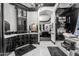 Elegant bathroom with black cabinets, marble countertops, and a luxurious chandelier at 3446 E Knoll St, Mesa, AZ 85213