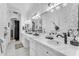 Bathroom featuring marble counters, mosaic tile floors, stone accents, and sinks at 3446 E Knoll St, Mesa, AZ 85213