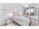 Bright bedroom with a chandelier, a built in bookcase, and window bench at 3446 E Knoll St, Mesa, AZ 85213
