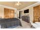 Spacious bedroom with wood accents and a dark duvet at 3446 E Knoll St, Mesa, AZ 85213