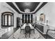 Dining room with a dark color palette and large chandelier at 3446 E Knoll St, Mesa, AZ 85213