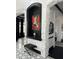 Chic entryway with stone accents, a decorative niche displaying art, and stylish black and white tile flooring at 3446 E Knoll St, Mesa, AZ 85213