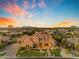 Expansive desert home featuring manicured landscaping, mature trees and hardscape at 3446 E Knoll St, Mesa, AZ 85213