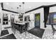 This kitchen features an island with seating, stainless steel appliances, and a doorway to the outdoor living area at 3446 E Knoll St, Mesa, AZ 85213