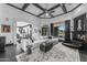 Spacious living room featuring a stone archway, fireplace, and views to backyard living spaces at 3446 E Knoll St, Mesa, AZ 85213