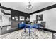 Spacious office featuring dark trim, custom rug, and a bold black and white wall at 3446 E Knoll St, Mesa, AZ 85213
