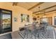 Outdoor patio with overhead beams, and a dining table at 3446 E Knoll St, Mesa, AZ 85213