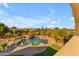 A gorgeous in-ground swimming pool and grotto with lush landscaping and a resort-style atmosphere at 3446 E Knoll St, Mesa, AZ 85213