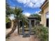 Outdoor sauna cabin with glass windows and palm tree in backyard at 3446 E Knoll St, Mesa, AZ 85213