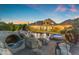 Luxurious pool area with a waterslide, spa, and rock features, perfect for relaxation and recreation at 3446 E Knoll St, Mesa, AZ 85213
