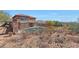 Rear view of a home with a backyard pool and patio, perfect for outdoor living and entertaining at 34714 N 21St Ln, Phoenix, AZ 85086