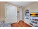 Bedroom with closet, decorative shelving, and hardwood flooring at 34714 N 21St Ln, Phoenix, AZ 85086
