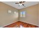 Inviting bedroom with ample natural light from the windows and gleaming hardwood floors at 34714 N 21St Ln, Phoenix, AZ 85086