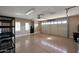 Spacious garage with epoxy floors, bright lighting, and storage racks for organization at 34714 N 21St Ln, Phoenix, AZ 85086