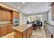 Open concept kitchen with granite countertops, stainless steel appliances, an island, and adjacent breakfast nook at 34714 N 21St Ln, Phoenix, AZ 85086