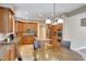 Spacious kitchen featuring granite countertops, stainless steel appliances, and a central island with an adjacent breakfast nook at 34714 N 21St Ln, Phoenix, AZ 85086