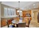 Eat in kitchen featuring wood cabinets, granite countertops, and stainless appliances at 34714 N 21St Ln, Phoenix, AZ 85086