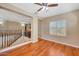 Bright living area showcasing hardwood floors and a ceiling fan for added comfort at 34714 N 21St Ln, Phoenix, AZ 85086