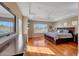 Spacious main bedroom boasts a tray ceiling, hardwood floors, and abundant natural light at 34714 N 21St Ln, Phoenix, AZ 85086