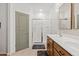 Bathroom featuring a double sink vanity and a glass enclosed walk-in shower at 3654 E Henson St, San Tan Valley, AZ 85140