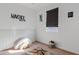 Well-lit bedroom featuring a modern design and a comfortable play area at 3654 E Henson St, San Tan Valley, AZ 85140