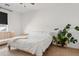Bright bedroom with a neutral color scheme, large window, and cozy decor at 3654 E Henson St, San Tan Valley, AZ 85140