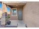 Inviting front entrance with a covered porch, decorative pot, and a 'Home Sweet Home' doormat at 3654 E Henson St, San Tan Valley, AZ 85140