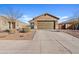 Charming single-story home with a two-car garage and low-maintenance landscaping on a sunny day at 3654 E Henson St, San Tan Valley, AZ 85140