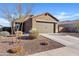 Charming single-story home with a two-car garage and low-maintenance landscaping on a sunny day at 3654 E Henson St, San Tan Valley, AZ 85140