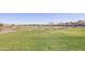 Expansive grassy field ideal for recreation and relaxation within the community at 3654 E Henson St, San Tan Valley, AZ 85140