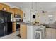 Modern kitchen featuring stainless steel appliances, granite countertops, and an island with bar seating at 3654 E Henson St, San Tan Valley, AZ 85140