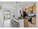 Modern kitchen with a granite island, stainless steel appliances, and bright natural light at 3654 E Henson St, San Tan Valley, AZ 85140