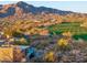 An aerial view of the house, community and golf course, blending luxury living with desert beauty and golfing at 39877 N 107Th Way, Scottsdale, AZ 85262