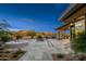 A serene backyard featuring a luxurious pool, spa, and lounge area with desert landscaping, perfect for relaxation and entertaining at 39877 N 107Th Way, Scottsdale, AZ 85262