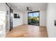 The bedroom features a sliding glass door, wood floors, and a fan at 39877 N 107Th Way, Scottsdale, AZ 85262