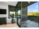 Bedroom featuring backyard views, built-in shelves, and sliding glass doors at 39877 N 107Th Way, Scottsdale, AZ 85262