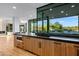 Gourmet kitchen featuring sleek cabinets, dark countertop and backyard views at 39877 N 107Th Way, Scottsdale, AZ 85262