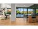 Open-concept kitchen featuring island with seating and backyard views and access at 39877 N 107Th Way, Scottsdale, AZ 85262