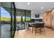 Open kitchen featuring island seating, stainless appliances and picturesque backyard views at 39877 N 107Th Way, Scottsdale, AZ 85262