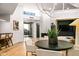 Bright and airy living room featuring a modern fireplace, wood floors, and high ceilings at 39877 N 107Th Way, Scottsdale, AZ 85262