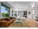 Spacious living room featuring a modern design, fireplace, and open concept layout at 39877 N 107Th Way, Scottsdale, AZ 85262